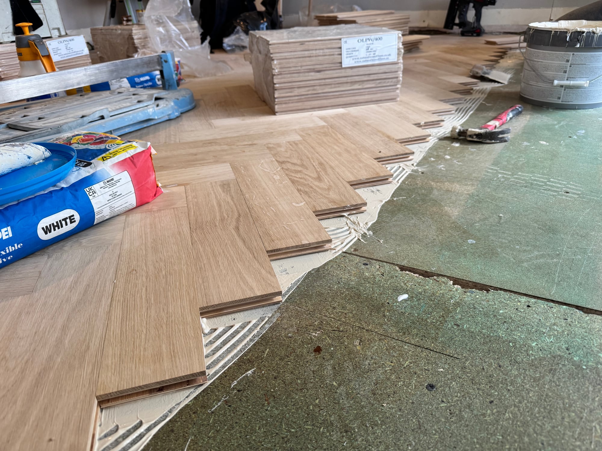 Engineered oak board installation in progress in a Fulham extension